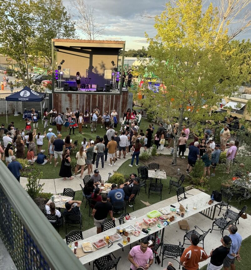 A crowd in front of the stage at the beer garden