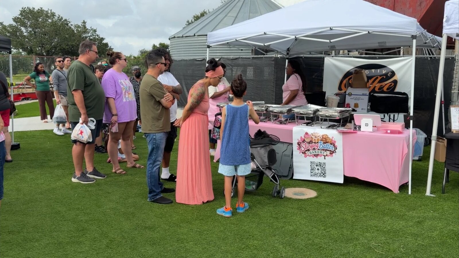 Shoppers lined up at the Slinging Batter Bakery booth on the lawn