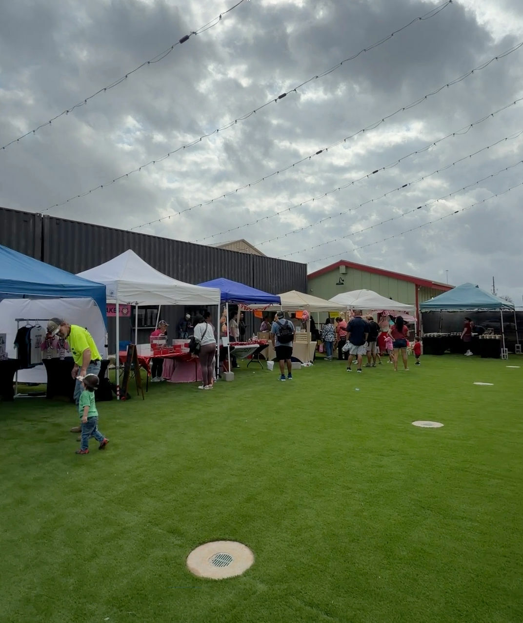 Colourful market tents on the green lawn
