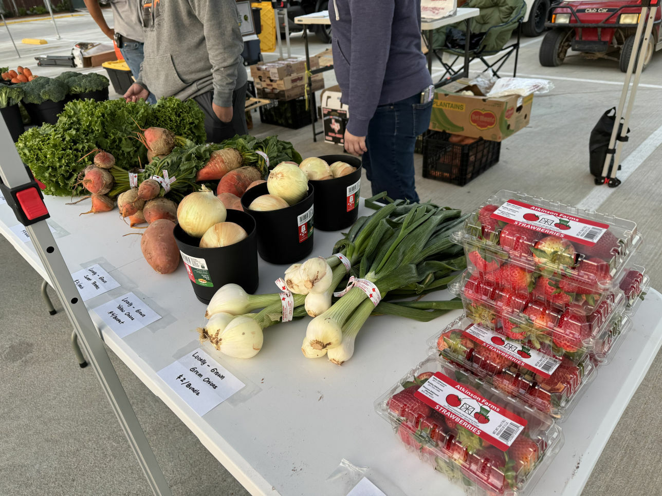 Fresh vegetables and strawberries on a market table